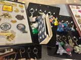 a lot of key chains that are in a case