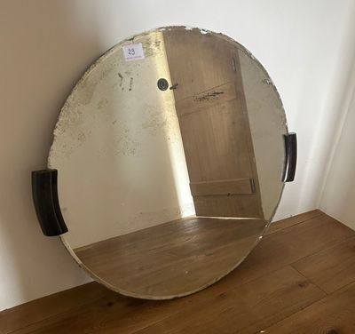 a mirror that is sitting on a wooden table