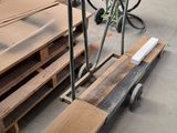 several pieces of wood are stacked on a pallet in a warehouse