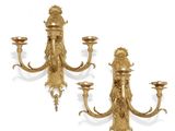 pair of antique brass wall sconces with lion heads on each of them