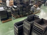 a large room with a lot of boxes and pallets on the floor