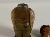 a figurine of an owl with a bottle opener attached to it