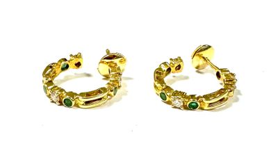 two pairs of gold earrings with emerald stones on them