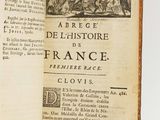 an open book with a picture of a military scene on it