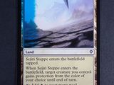 a close up of a card with a picture of a wave on it
