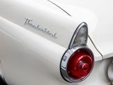a close up of a white car with a red tail light