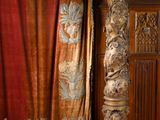 a large wooden cabinet in the middle of a room