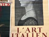 a poster of a woman with a pearl necklace on a wall