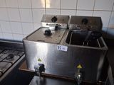 a picture of a kitchen with a stove and a sink