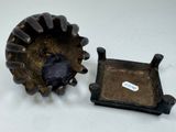 a small metal object that is sitting next to a small metal object