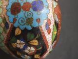 a person holding a decorative object in their hand
