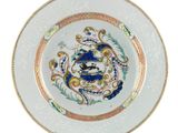 an image of a white plate with a blue and gold design on it