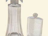 a glass bottle with a soap dispenser next to a glass bottle with a soap dispenser