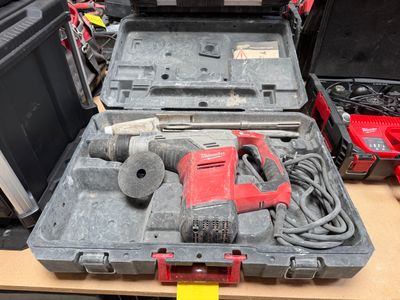 a tool box with tools in it sitting on a table