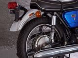 a blue and black motorcycle parked in a parking garage