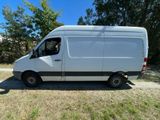 the white van is parked on the side of the road