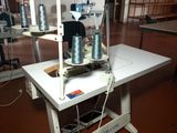 an image of a sewing machine in a factory