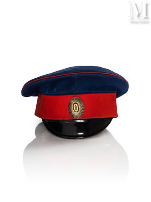 red and blue hat with a crest on top of it
