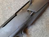 a gun that is laying on the floor next to the floor
