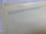 two open books on a table with a white background