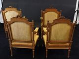 a pair of antique chairs with cane back and cane back