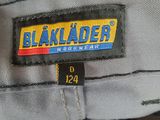 the back of a gray shirt with a black label on it