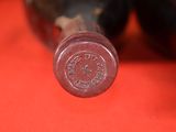 a close up of a bottle of wine on a table