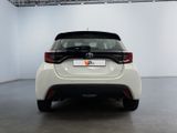 the rear end of a white toyota c - hr in a white room