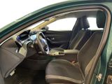 the interior of a green car with a steering wheel and a dashboard