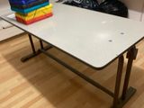 a table that has a bunch of books on it