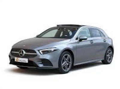 a silver mercedes cla parked in front of a white background