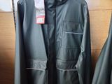 two jackets hanging on a rack in a store