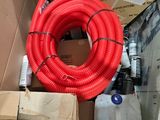 a red hose sitting on top of a cardboard box