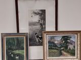 three framed pictures of a dog and a duck on a table