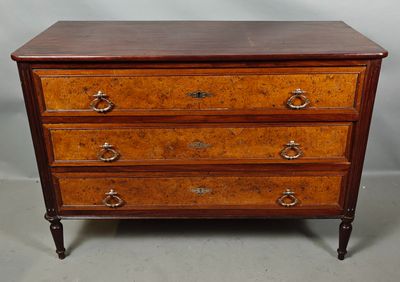 a wooden chest of drawers with three drawers on each side
