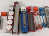 many different types of toy trains on the table
