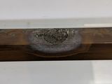 a close up of a piece of wood on a table