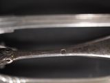 a close up of a spoon and a spoon rest on a table