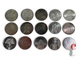 a lot of coins that are on a white surface