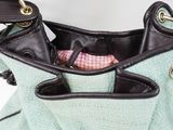 a purse with a handle and a pocket inside of it