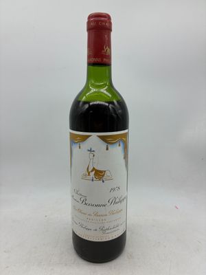 a bottle of wine that is sitting on a table