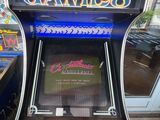 a game machine that is sitting in front of a window