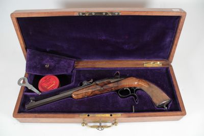 a wooden case with a gun inside of it