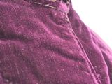 a close up of a purple jacket on a mannequin