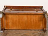 a wooden chest with a metal handle on it