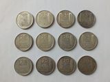 a close up of a bunch of coins sitting on top of a table