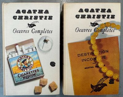 two boxes of cigarettes and a book on the table