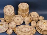 a lot of plates and bowls on the table