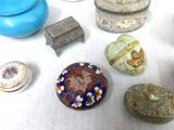 many different types of jewelry on a white surface