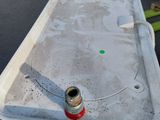 a water tank that has a hose attached to it